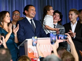 Surrounded by family, Wab Kinew gives his victory speech at NDP provincial election night headquarters at the Hotel Fort Garry in Winnipeg on Tuesday, Oct. 3, 2023.