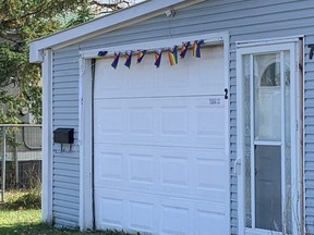 A Pride flag is missing from the front of Tim Cunningham's home on Beech Street in Aylmer after it was ripped down on Saturday by an unknown male. The flag was flying from a pole on the left side of the garage before it was stolen. Photo taken on Tuesday, Oct. 31, 2023. (Heather Rivers/The London Free Press)