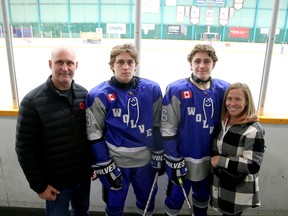 Sudbury Wolves alumnus Gary Coupal, left, poses for a photo with twin sons Ben (63) and Oliver (66), both forwards for the Central Ontario Wolves U18 AAA team, and wife Jaimie prior to a game at the Big Nickel Major AAA Hockey Tournament at Gerry McCrory Countryside Sports Complex in Sudbury, Ontario on Thursday, November 2, 2023. Tournament action continues through Sunday.