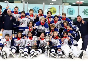 Members of the of the Sudbury Wolves celebrate after defeating the Ottawa Junior 67's to capture the U14 division at the Big Nickel Major AAA Hockey Tournament.