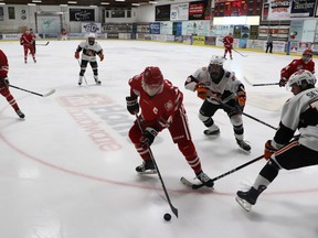Whitecourt Wolverines player Dylan Leslie kept the puck from the Lloydminster Bobcats’ Blake Setter. The Wolverines hosted the Bobcats at JDA Place on the afternoon of Nov. 5.