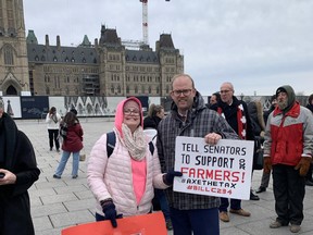 Peace River–Westlock MP Arnold Viersen, right, joined farmers in a protest on Parliament Hill, backing Bill C-234. The bill would allow a carbon tax exemption on grain drying, barn heating and other farm operations.