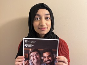United Way Perth-Huron social research and planning council manager of data and social research Areeba Ahmad holds one of the chapters of the new Quality of Life Report for the Huron-Perth region.