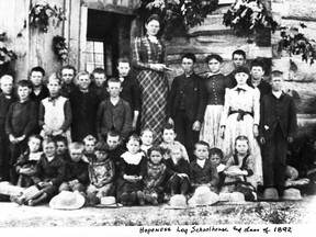 Miss Mary Ireton and the class of 1892 at Hopeness log school house.- Bruce County Museum & Cultural Centre, AX977.045.001a