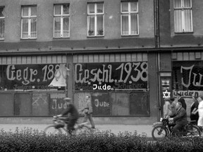 A photo dated Nov. 10, 1938 in an unnamed city in Germany, shows a Jewish-run store after it has been vandalized and its front wall defaced with antisemitic graffiti, likely on Kristallnacht, 'The Night of Broken Glass.'