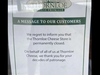 A sign posted on the door announces the closure