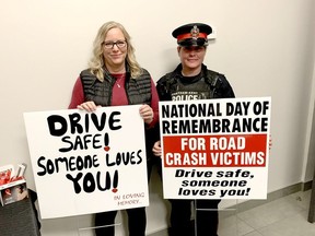 Rachelle Mattsson, left, and Chatham-Kent police Const. Kristen Charron, display signs promoting safe driving during a National Day of Remembrance for Road Crash Victims, held Wednesday. Ellwood Shreve/Postmedia