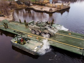 Members of the 4th Engineer Support Regiment conduct a raft crossing Nov. 9 on the St. John River near 5th Canadian Division Support Base Gagetown during the Exercise NIHILO SAPPER training exercise.