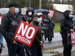 A group of North Grenville residents protests with 'No Prison' signs at the site of a proposed correctional facility on Kemptville Campus land in 2021.