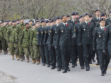 The honour guard and legionnaires arrive to the Captain Matthew J. Dawe Memorial Branch Remembrance Day service in W. C Warnica Memorial Park in Kingston, Ont. on Saturday, Nov. 11, 2023.