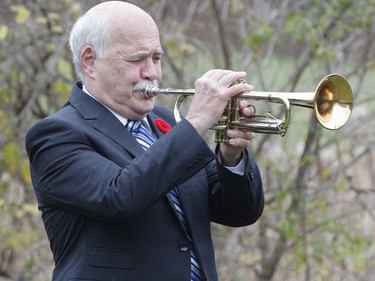 Bugler Larry Stafford plays Last Post during the Captain Matthew J. Dawe Memorial Branch Remembrance Day service in W. C Warnica Memorial Park in Kingston, Ont. on Saturday, Nov. 11, 2023.