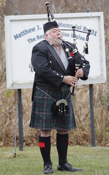 Piper John Hume plays the Lament after the moment of silence during the Captain Matthew J. Dawe Memorial Branch Remembrance Day service in W. C Warnica Memorial Park in Kingston, Ont. on Saturday, Nov. 11, 2023.
