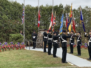 The flags are lowered during the Captain Matthew J. Dawe Memorial Branch Remembrance Day service in W. C Warnica Memorial Park in Kingston, Ont. on Saturday, Nov. 11, 2023.