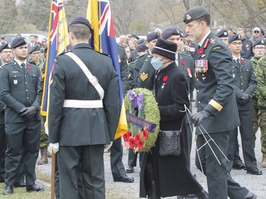 Silver Cross mother Reine Dawe, with her son, during the Captain Matthew J. Dawe Memorial Branch Remembrance Day service in W. C Warnica Memorial Park in Kingston, Ont. on Saturday, Nov. 11, 2023.