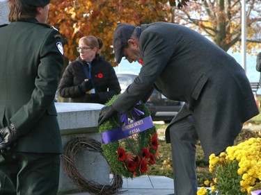 A wreath is laid at the foot of the Cross of Sacrifice at Macdonald Memorial Park on Saturday as part of the city's civic Remembrance Day ceremony. A large gathering of military personnel, veterans, first responders, officials and residents attended the annual event on a cold but sunny morning. (Jan Murphy/Postmedia Network)