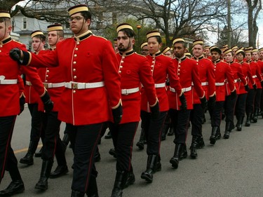 Royal Military College cadets lead the Remembrance Day Parade into Macdonald Memorial Park on Saturday as part of the city's civic Remembrance Day ceremony. A large gathering of military personnel, veterans, first responders, officials and residents attended the annual event on a cold but sunny morning. (Jan Murphy/The Kingston Whig-Standard/Postmedia Network)