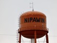An orange-coloured water tower with name Nipawin