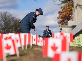 Flags are planted by the Cenotaph at Sunnybrook Hospital ahead of Remembrance Day, in Toronto, Friday, Nov. 10, 2023.