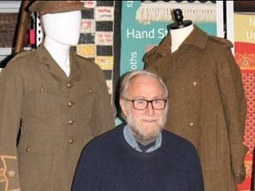 Charlie Fairbank is pictured at Lambton Heritage Museum in Grand Bend, showing the recently donated great coat and uniform of his grandfather.