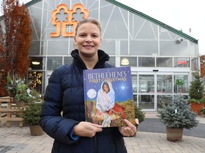 Aprille Willemse, a Sarnia-area teacher, holds a copy of Bethlehem's First Christmas, her self-published children's storybook. She'll be signing copies Saturday at DeGroot's Nurseries in Sarnia, from 10 a.m. to 4 p.m.