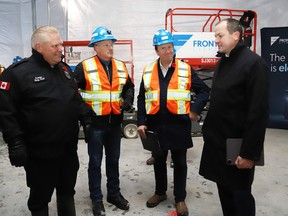 Trevor Walker, right, president and CEO of Frontier Lithium, gives a tour of his facility for Ontario Premier Doug Ford, left, Greg Rickford, Minister of Northern Development, and Greater Sudbury Mayor Paul Lefebvre following a provincial funding announcement in Val Caron on Thursday November 9, 2023.