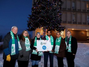 The Huntington University tree was officially lit for the season on Nov. 27 in support of the Sudbury Action Centre for Youth. From the left area Scott Darling (board vice-chair, Huntington University), Mary-Liz Warwick (board chair), Katie Morin (board chair, Sudbury Action Centre for Youth), Arvind Mohandoss (executive director, Sudbury Action Centre for Youth), Bela Ravi (chancellor, Huntington University) and Kevin McCormick (president and vice-chancellor, Huntington University). Gino Donato photo