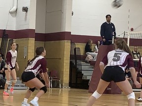 Players for Pauline Johnson Collegiate prepare to return a serve from Paris District High School on Thursday in AABHN senior girls volleyball action at PJC. Expositor Staff