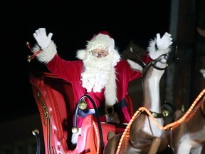 Santa waves to the crowd gathered outside Owen Sound city hall at the 78th annual Kiwanis Owen Sound Santa Claus Parade Saturday night. Greg Cowan/The Sun Times