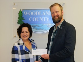 Glenda Farnden, STARS air ambulance municipal relations liaison, accepted a cheque from Dave Kusch, Woodlands County reeve, on Wednesday. The cheque is for $14,250, with Woodlands County making this contribution annually to support the service.