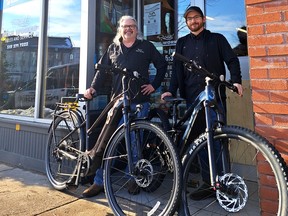 Ross Taylor, owner of Ross' Bike Works, and employee AJ Barclay pose with two e-bikes that were recovered by Stratford police after they were stolen from the Stratford bicycle shop during a break-in on the night of Nov. 28.
