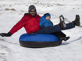 Winter Frolic attendees go tubing down the snow mountain at the New Brunswick Provincial Exhibition Grounds in this file photo. Event organizers say the Winter Frolic will be back in 2024, but has been moved to mid-February due to a lack of snow early in the season.