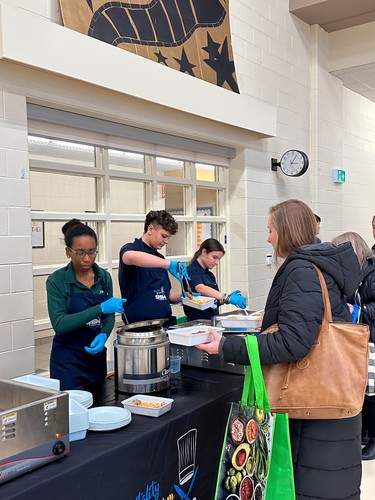 St. Benedict students serve food