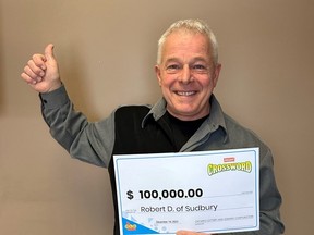 Robert Dagenais of Sudbury is celebrating after winning a $100,000 top prize with Instant Crossword Tripler.