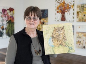 Artist Beth Stewart shows her Salthaven Owl, a work done in coloured pencil on cradled board, on Tuesday, Nov. 28, 2023, in London. Stewart's work is one of nearly 500 artworks featured in the Square Foot Show opening at Westland Gallery on Wednesday, Dec. 6, 2023. (Derek Ruttan/The London Free Press)