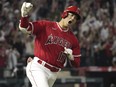 Los Angeles Angels' Shohei Ohtani celebrates as he rounds first after hitting a two-run home run during the seventh inning of a baseball game against the New York Yankees Monday, July 17, 2023 (AP Photo/Mark J. Terrill, File)