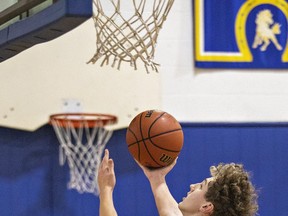 Andrew McGarr of the Assumption Lions goes to the hoop with a shot during an AABHN high school senior boys basketball game against the BCI Mustangs on Tuesday December 12, 2023 in Brantford, Ontario. Brian Thompson/Brantford Expositor/Postmedia Network