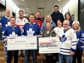 The Chatham Goodfellows initially received a $42,065 donation from Enbridge on Monday for its No Child Without a Christmas campaign, but were pleasantly surprised when it was topped up to $45,000. Enbridge employees are seen here on jersey day presenting a cheque to Goodfellows representatives. (Handout)