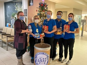 Cornwall Community Hospital staff members with an Agapè Centre donation bin