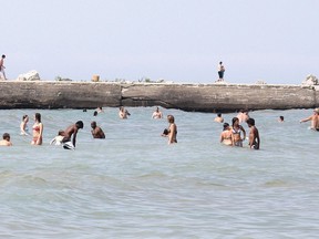 People flock to Kincardine's Station Beach on Lake Huron in this file photo.