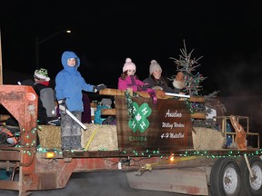 The Anselmo Willing Workers joined the Mayerthorpe Christmas Lite-Up parade on Friday night. This year's parade had a theme of a "Rustic Christmas," and it appeared the Anselmo 4-H Club members willingly worked hard on their entry.