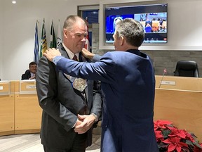 Brian Milne, left, is presented with the warden's chain of office by Paul McQueen at the 2024 Grey County Council Inaugural Session in Owen Sound on Tuesday, December 5, 2023.