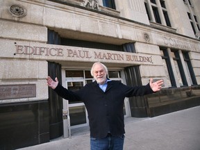 WINDSOR, ONT: DECEMBER 14, 2023. Rob Myers, CEO and Founder, RM Group of Companies poses in front of the Paul Martin Building in downtown Windsor on Thursday, December 14, 2023. The Chatham based businessman purchased the downtown landmark and plans on converting it to a boutique style hotel.