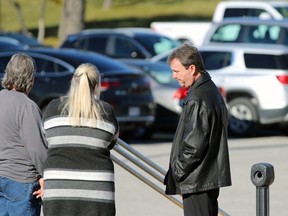 Shawn Trowbridge talks to family and friends outside the Sarnia courthouse during a break in his first-degree murder trial on Monday, Nov. 13, 2023. (Terry Bridge/Postmedia Network)