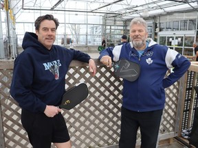 Mike Barron, left, and Mike Van Hemmen of the new Sarnia-Lambton Pickleball Club are seen at the temporary indoor courts at DeGroot's Nurseries in Sarnia.