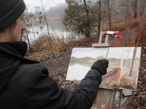 Tyler Scott paints by Lake Chipican in Sarnia's Canatara Park Dec. 23, 2023