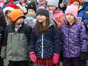 Students from Ecole Alliance St-Joseph in Chelmsford, Ont. sing Christmas carols outside the school on Wednesday December 20, 2023, as parents looked on.