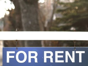 A For Rent sign is shown in front of a rental property.