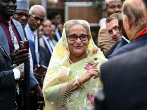 Bangladesh's Prime Minister Sheikh Hasina accepts greetings a day after winning parliamentary elections, in Dhaka on Jan. 8. Hundreds of opposition politicians were jailed, at least 16 people were killed and opposition parties boycotted the vote altogether.
