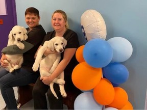 Lynn Walker, left, Fredericton SPCA lead supervisor and Andrea Stone, SPCA supervisor, are pictured with puppies Tarzan and Buzz.