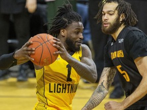 Marcus Ottey of the London Lightning attempts to drive past Jeremy Harris of the Sudbury Five during their game at Budweiser Gardens in London on March 15, 2023. Derek Ruttan/The London Free Press